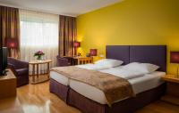 Postel nebo postele na pokoji v ubytování Appartement-Hotel an der Riemergasse