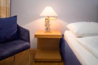 Postel nebo postele na pokoji v ubytování Appartement-Hotel an der Riemergasse