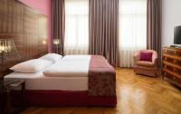 Postel nebo postele na pokoji v ubytování Appartement-Hotel an der Riemergasse