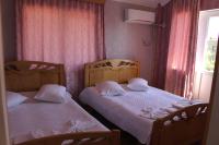 Ein Bett oder Betten in einem Zimmer der Unterkunft Hotel Evrazia