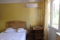 Ein Bett oder Betten in einem Zimmer der Unterkunft Hotel Evrazia