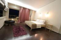 Posteľ alebo postele v izbe v ubytovaní Aerides Luxury Villa