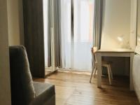 Een zitgedeelte bij Villa Tarbis Tarbes centre ville , appartements tout confort