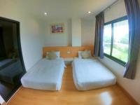 Postel nebo postele na pokoji v ubytování Klongrien Boutique Hotel