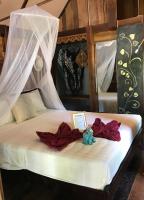 Postel nebo postele na pokoji v ubytování KALUME' Eco Boutique Resort-Adult only