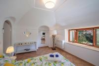 A bed or beds in a room at Villa Eos