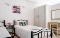 Posteľ alebo postele v izbe v ubytovaní Stavros Villas&Apartments