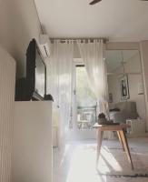 A television and/or entertainment centre at Stefanias sunny Acropolis Studio on Drakou pedestrian