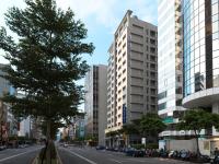 a street in a city with tall buildings at K Hotel Taipei Songjiang in Taipei