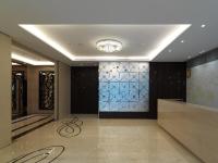 a lobby with a wall with a stained glass window at K Hotel Taipei Songjiang in Taipei