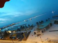 a view of a beach at night with boats in the water at Antibes: A nest perched on the sea! in Antibes