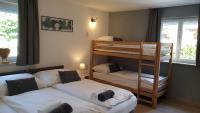 Łóżko lub łóżka w pokoju w obiekcie Alpen Appartements Viehhofen - incl Sommercard Zell am See Viehhofen