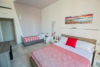 A bed or beds in a room at Bayard101