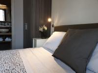 A bed or beds in a room at Bayard101
