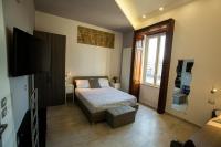 A bed or beds in a room at Bayard101