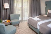 Łóżko lub łóżka w pokoju w obiekcie SeaPark Hotel Wellness & Spa