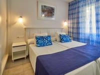 Łóżko lub łóżka w pokoju w obiekcie BQ Alcudia Sun Village