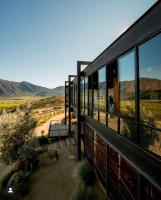 a building with windows and a view of the desert at Encuentro Guadalupe in Valle de Guadalupe