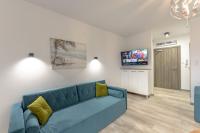 Televízia a/alebo spoločenská miestnosť v ubytovaní Perfekt Apartments 5 Mórz Sianożęty
