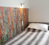 Posteľ alebo postele v izbe v ubytovaní Apartament Logana z Sauną - 5D Apartamenty