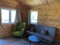 A seating area at Napsugár Club és Panzió
