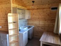 A kitchen or kitchenette at Napsugár Club és Panzió
