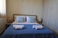 Ein Bett oder Betten in einem Zimmer der Unterkunft Markellas Summer House