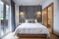 Postel nebo postele na pokoji v ubytování Oikia guesthouse