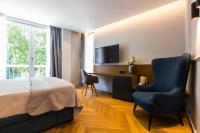 Televízia a/alebo spoločenská miestnosť v ubytovaní Muse luxury rooms