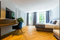 Televízia a/alebo spoločenská miestnosť v ubytovaní Muse luxury rooms