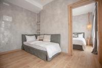 Postel nebo postele na pokoji v ubytování Oikia guesthouse
