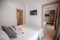 Postel nebo postele na pokoji v ubytování Oikia guesthouse