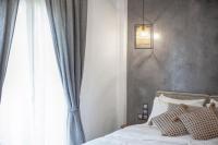 Postel nebo postele na pokoji v ubytování Oikia guesthouse