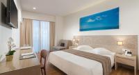 Posteľ alebo postele v izbe v ubytovaní Alexandra Hotel&Apartments
