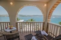 a balcony with a view of the ocean at Hotel Vila Tina in Trogir