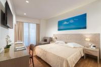 Posteľ alebo postele v izbe v ubytovaní Alexandra Hotel&Apartments