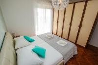 Posteľ alebo postele v izbe v ubytovaní Family Beach Apartments