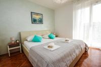Posteľ alebo postele v izbe v ubytovaní Family Beach Apartments
