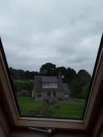 a view of a house from a window at La Bannerie in Mesnil-Clinchamps