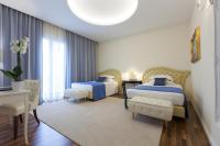 A bed or beds in a room at Grand Hotel Salsomaggiore