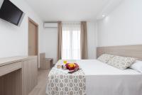 Posteľ alebo postele v izbe v ubytovaní Hotel Olympia Ronda II
