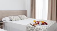 Posteľ alebo postele v izbe v ubytovaní Hotel Olympia Ronda II