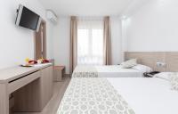 Posteľ alebo postele v izbe v ubytovaní Hotel Olympia Ronda II