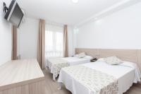 Posteľ alebo postele v izbe v ubytovaní Hotel Olympia Ronda II