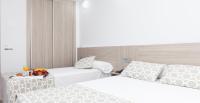 Posteľ alebo postele v izbe v ubytovaní Hotel Olympia Ronda II