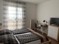 Posteľ alebo postele v izbe v ubytovaní Liliom Apartman Pécs