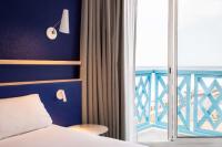 Cama ou camas em um quarto em Hotel Paradou Mediterranee, BW Signature Collection by Best Western