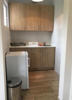 A kitchen or kitchenette at Napsugár Club és Panzió