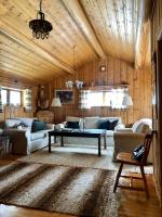 a living room with a couch and a table at Lillstugan in Sälen