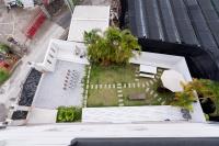 an aerial view of a building with a garden at Taitung Quality B&amp;B in Taitung City